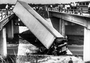 Truck ran through a bridge railing, down between two bridges and landed on the highway below, lithonia, georgia, usa, 1968
