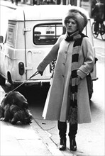 Woman with dog in montenapoleone street, milan, 80's