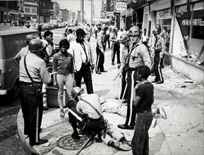Newark riots, policemen arresting black people, 1967