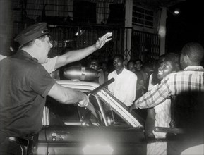 Policeman shouts at a negro during a angry demonstration following the shooting of a 14 year old youth by a detective
