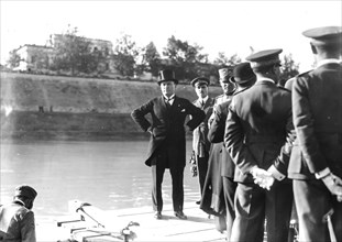 Mussolini on the banks of the tevere awaits the arrival of francesco de pinedo at the end of the air cruise in the far east, 7th november 1925