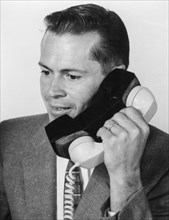 A man with a phone encryption for secure calls, 1960