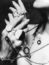 Hands of a woman with jewelry 60 years'