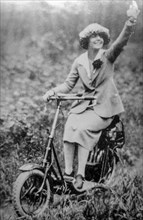 Woman on scooter, 50s