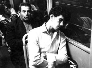 A man sleeping on a tram after a day at work, Milan, Italy, 70s
