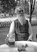 Elderly man drinking beer, Munich, Germany