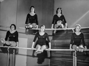 Gymnasts on the uneven bars, 1962