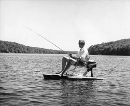 Man fishing, 70s