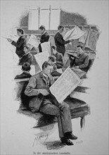 Man Reading Newspaper In An Academic Reading Room