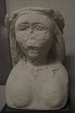 Female stone bust.