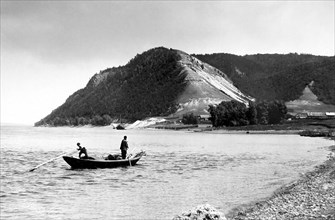 View of Bald Mountain and fishermen in foreground near Morkvashi village