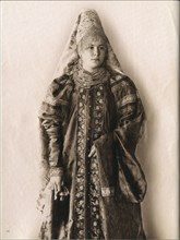 Young Russian woman in culltural and traditional folk dress