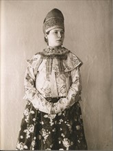 Young Russian woman in traditional cultural dress from Central Russia