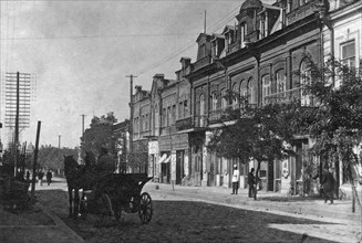 Man driving a horse drawn carraige on Petersburg Street in Lugansk or Luhansk Ukraine circa  before 1917