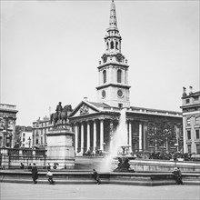 Fountain In Trafalgar Square Showing Equestrian Statue Of Charles I And St Martin-In-The-Fields.