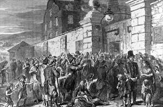 The Irish Famine, starving Peasants At Workhouse Gate.