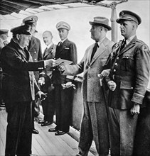A letter from His Majesty the King being presented to Mr President Roosevelt by Mr Churchill.