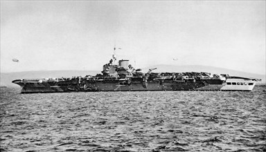 Aircraft Carrier H.M.S. Victorious at anchor.