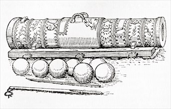 A 15th century hand cannon with cannon balls.