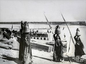 Children bringing water from the Nile in the early 20th century.