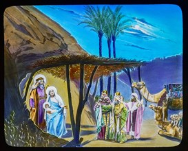 The three kings visit jesus, Mary and Joseph in the manger.