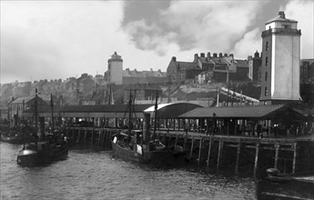 Fish Quay with fishing boats and buildings.