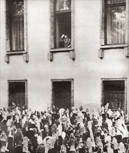 Germans cheering Hitler on hearing the news of his election as chancellor in 1933.