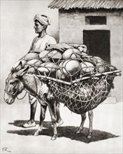 Carrying pots to market in India.