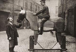 Training raw recruits the rudiments of riding on dummy horses at the start of WWI in 1914.