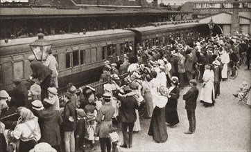 A draft of men board the train in Hounslow.