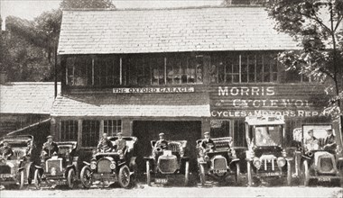A row of early Morris cars parked outside The Oxford Garage.
