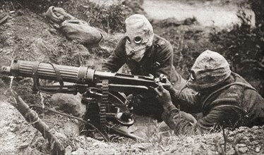 Two soldiers wearing respirators to protect them from poison gas during WWI.