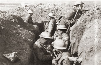 Tin-hatted British troops in the front line opposite St. Quentin during the advance in 1917 to the Hindenburg line on the Western Front during WWI.