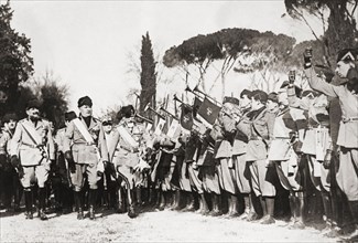 Benito Mussolini inspecting troops.