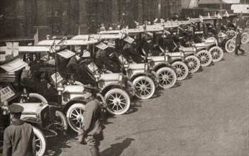 A row of taxi cabs waiting to take Automobile Association offiers and patrols to the White City to form the nucleus of a new cyclist battalion.