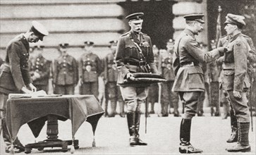 King George V awarding a soldier the Victoria Cross.