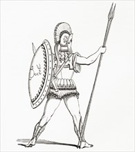 A heavily armed Greek warrior dressed for battle. From The Imperial Bible Dictionary.