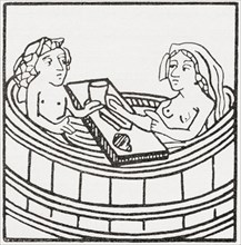 Man and woman together in a bathtub eating and bathing.