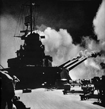 A salvo being fired from the aft turret of the North Carolina.