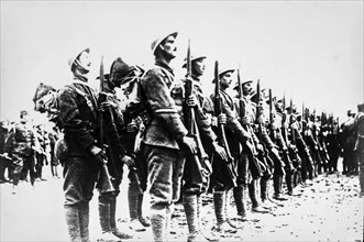World war one soldiers standing to attention in a line.