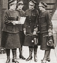 Women working as porters, guards and inspectors on the London underground railway during World War One.