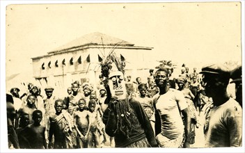 Crowd surround a tribal healer