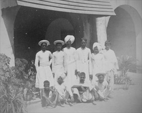Group portrait of 10 Indian male servants, Calcutta