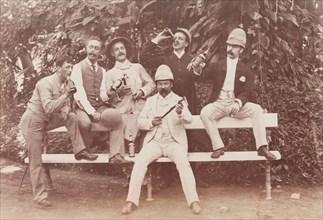 Group of men posing in the Botanical Gardens, Calcutta