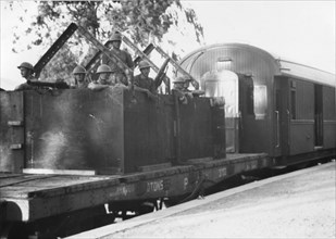 An armored train guarded by British troops leaves Jerusalem.