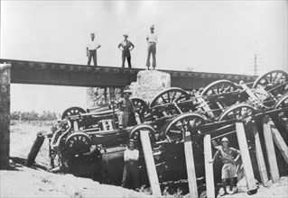A derailed locomotive in Palestine.