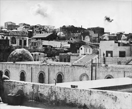 Explosions are shown in Jaffa's slums where British soldiers used dynamite to destroy munitions depots the Arabs were using.