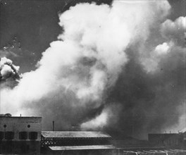 Explosions are shown in Jaffa's slums where British soldiers used dynamite to destroy munitions depots the Arabs were using.