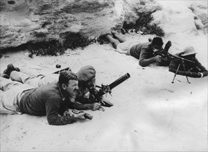 The Jewish army training in Tel Aviv in Palestine. This photo taken by a special correspondent from the New York Times shows Hagannah soldiers training in the handling of a 75 mm mortar and that of a ...