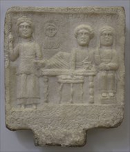 Goddess Bendis and a family group: bust of a child and feasting husband and wife. Inscription in